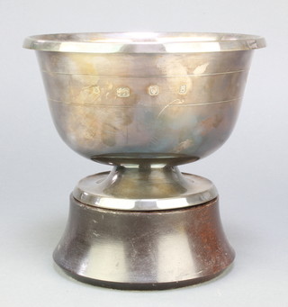 A silver pedestal rose bowl with rose decoration, London 1976 designed by Algernon Asprey on wood socle 566 grams 7 1/2" 