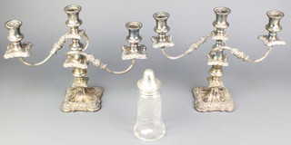A silver mounted cut glass sugar shaker London 1919, a pair of plated 3 light candelabra 