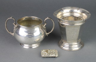 A silver plated repousse vesta, ditto vase and sugar bowl