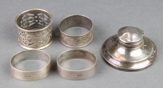 A silver capstan inkwell Birmingham 1919 2 3/4" and 4 silver napkin rings