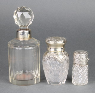 An Edwardian silver mounted cut glass toilet bottle 3 1/2" and 2 others