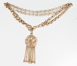 A 9ct yellow gold double link bracelet with tassel and a 9ct yellow gold locket 