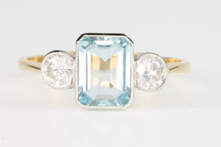 An 18ct yellow gold aquamarine and diamond ring, size N