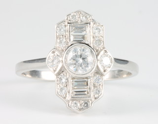 An Art Deco style 18ct white gold and diamond up finger ring, approx. 0.75ct size O 1/2