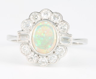 An 18ct white gold opal and diamond cluster ring, size P 