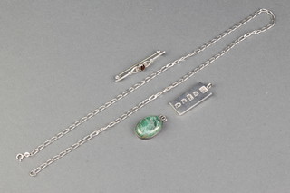 A silver ingot, ditto necklace, brooch and pendant