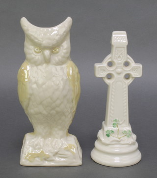 A Belleek figure of an owl with green marks 8 1/2" together with a modern Celtic High Cross 7 1/2" 