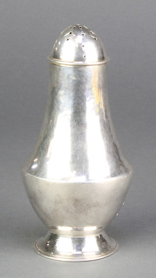 A contemporary silver pepperette of plain form London 1970 150 grams
