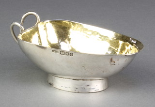 A contemporary silver bowl in the form of a leaf with gilt interior London 1960, 114 grams