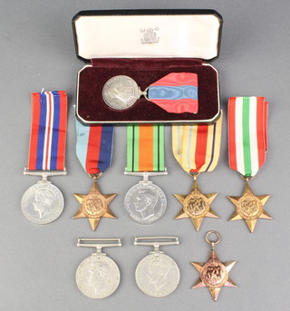 An Imperial Service medal to Minnie Sophia Ashby cased, a 1939-45 Star, Italy Star, 2 Africa Stars, 2 Defence medals, 2 British War medals  

