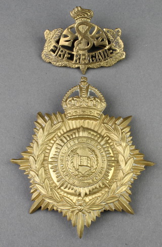 A George V Fireman's brass helmet badge, a NSW lapel ditto 
