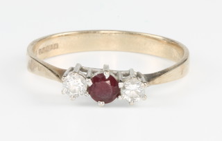A 9ct yellow gold ruby and diamond 3 stone ring size Q 1/2