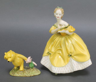 A Royal Doulton figure - The Last Waltz HN2315 8" and a Royal Doulton group from the Winnie The Pooh Collection Pooh and Piglet to the Windy Day WP2 3" 
