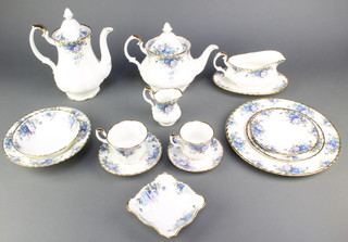 A Royal Albert Moonlight Rose coffee, tea and dinner service comprising 6 coffee cups, 6 saucers, 6 tea cups, 6 saucers, teapot, coffee pot, cream jug, 6 tea plates, 6 small plates, 6 medium plates, 6 dinner plates, 6 dessert bowls, 6 soup bowls, sauce boat and stand and a dish 