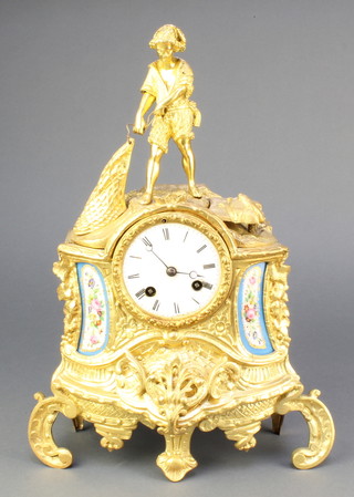 Miyor, a French 19th Century striking mantel clock with enamelled dial and Roman numerals contained in a gilt spelter case and with "Sevres" panels to the sides