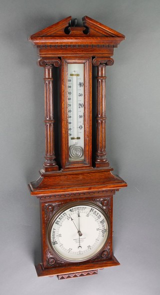 Benetfink & Co, a Victorian aneroid barometer and thermometer with enamelled dial contained in a carved oak case with Ionic column decoration to the side 