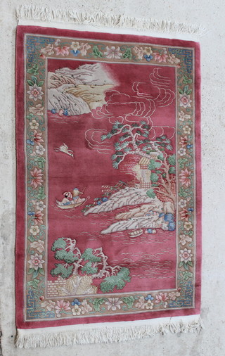 A red ground Chinese rug decorated an island, tree and fishing boat, 73" x 48" 