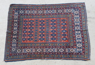A Caucasian style brown ground rug with medallion to the centre within multi row borders 76" x 53" 