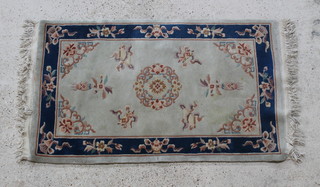 A white and blue ground Chinese rug 63" x 36" 