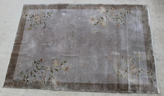 A brown ground and floral patterned Chinese rug of sculptured design 108" x 73" 