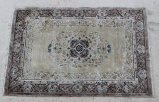 A green ground Chinese silk rug with sculptured design 73" x 49" 
