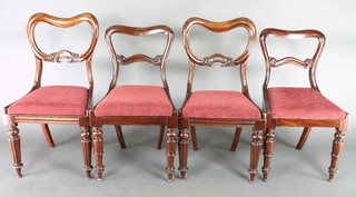 A harlequin set of 4 Victorian mahogany buckle back dining chairs with carved mid rails and drop in seats, comprising 2 pairs of chairs, 1 pair on turned and reeded supports the other on turned supports
