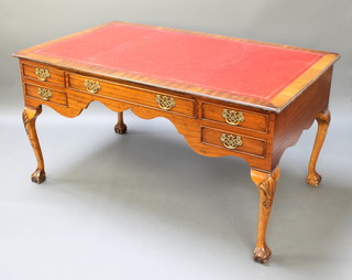 A Chippendale style mahogany writing table with red inset writing surface above 1 long and 4 short drawers raised on cabriole ball and claw supports 31"h x 60"w x 36"d together with a Chippendale slat back chair with upholstered drop in seat, raised on cabriole supports