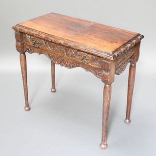 A Victorian carved oak side table fitted a drawer, raised on club supports 28"h x 33"w x 17 1/2"d 