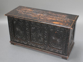 A Victorian ebonised carved oak coffer with hinged lid and panelled decoration to the front 20"h x 38 1/2"w x 16"d 