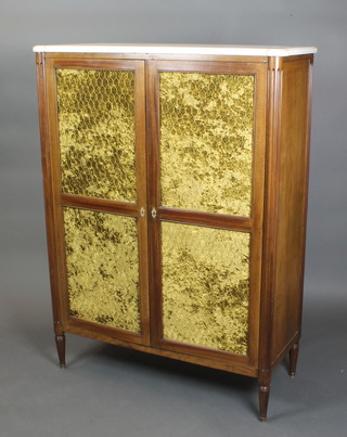 A 19th Century French walnut cabinet with white veined marble top and fluted columns to the sides, fitted shelves and enclosed by a pair of grilled panelled doors, raised on turned supports, 59"h x 43"w x 15 1/2"d 