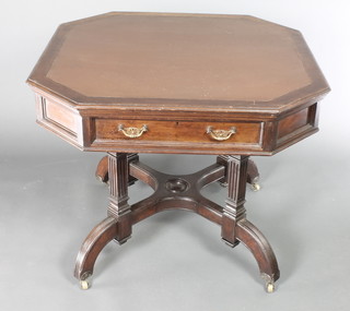 A Maples & Co octagonal mahogany aesthetic movement library table with inset writing surface fitted 2 drawers, raised on 4 turned and fluted columns with X framed stretcher 29"h x 36"w x 36"d  