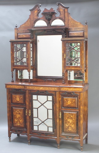 A good Edwardian rosewood chiffonier sideboard, the raised back fitted a rectangular plate mirror flanked by a pair of cupboards enclosed by bevelled plate panelled doors, the base fitted a central cupboard enclosed by a bevelled plate mirror panelled door flanked by a pair of inlaid panelled doors, raised on turned feet 94"h x 54"w x 16"d  