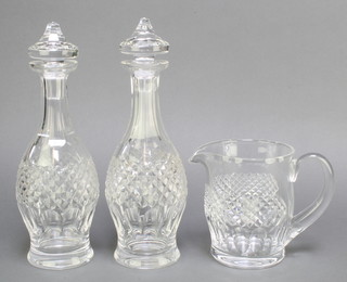 A Waterford Crystal Colleen pattern water jug and a pair of ditto mallet shaped decanters  