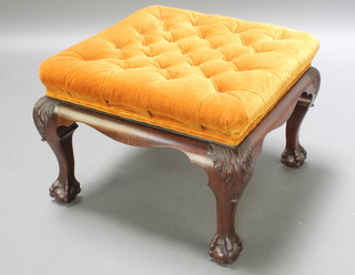 A rectangular Chippendale style footstool, the seat upholstered in mustard coloured buttoned Dralon on cabriole supports 18"h x 24"w  