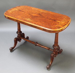 A Victorian oval figured and inlaid walnut stretcher table with quarter veneered top, raised on turned supports with H framed stretcher 28"h x 41"w x 21"d 