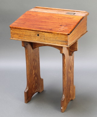 A child's 19th Century pine school desk with brass inkwell fitting 30"h x 21"w x 17"d 
