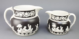 Two 19th Century Spode stoneware 2 colour jugs decorated with cavorting cherubs 5" and 7" 