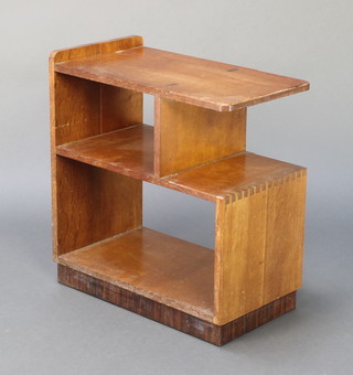 In the manner of Heals, an Art Deco rectangular oak 2 tier occasional table incorporating shelves 21"h x 19 1/2"w x 11"d 