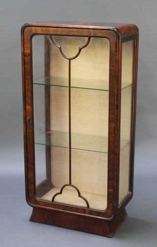 An Art Deco walnut display cabinet, fitted shelves enclosed by astragal glazed panelled doors 45 1/2"h x 22"w x 12"d 
