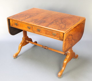 A Queen Anne style figured walnut and crossbanded sofa table with feather banding, raised on trestle supports with turned undertier 28"h x 36" x 60 1/2" when extended x 24"w