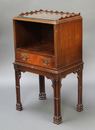 A Chippendale style mahogany bedside cabinet with quarter veneered top and three-quarter gallery, raised on column supports 30"h x 17"w x 12 1/2"d 