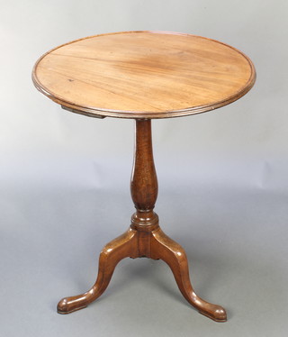 A Victorian circular bleached mahogany dish top wine table, raised on a turned column and tripod base 29"h x 23" diam. 