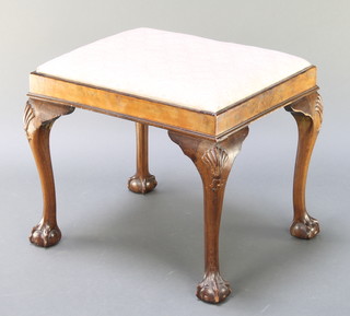 A Queen Anne style rectangular walnut dressing table stool raised on cabriole, ball and claw supports 18" x 21 1/2"w x 17 1/2" 