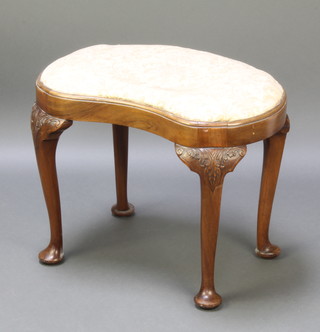 A Queen Anne style walnut kidney shaped dressing table stool with upholstered drop in seat, raised on carved cabriole supports 17"h x 24"w x 14"d 