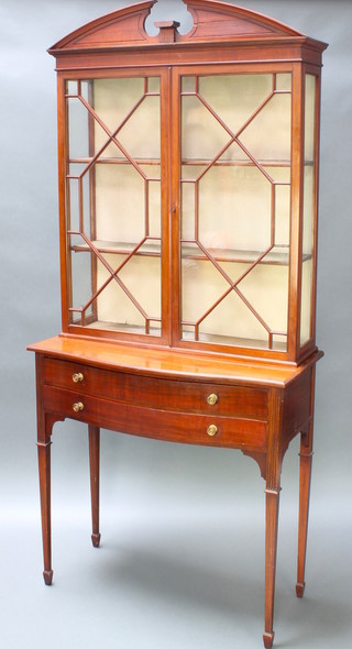 An Edwardian Georgian style mahogany display cabinet, the upper section with broken pediment, fitted adjustable shelves enclosed by astragal glazed panelled doors, the base fitted 2 long drawers, raised on square tapering supports spade feet 80"h x 36"w x 18"d 