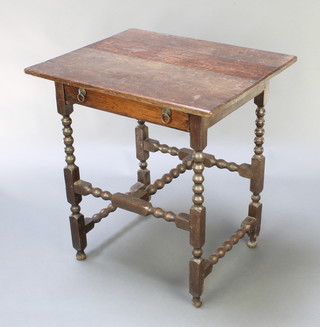 An 18th Century rectangular oak side table fitted a drawer, raised on bobbin turned supports with H framed stretcher 29"h x 26 1/2"w x 22" 