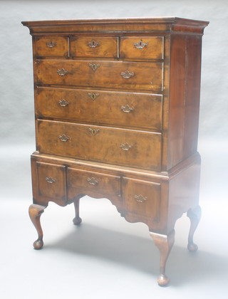 A Queen Anne style walnut chest on stand, the upper section with moulded cornice fitted 3 short drawers above 3 long drawers, the base fitted 1 long drawer flanked by 2 short drawers, raised on cabriole supports 60 1/2"h x 40"w x 22"d 