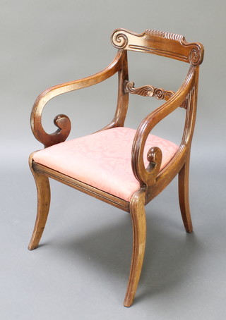 A 19th Century mahogany carved bar back carver chair, with mid rail and upholstered drop in seat, on sabre supports 