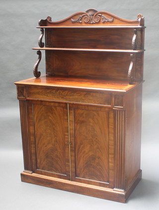 A Regency mahogany chiffonier with raised shelf back, the base fitted a drawer enclosed by a double cupboard and flanked by a pair of reeded columns, raised on a platform base 62"h x 40"w x 20 1/2"d  