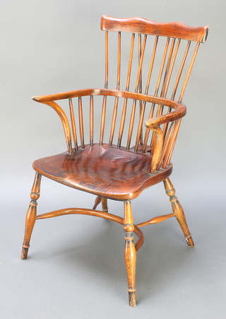 An elm stick and bar back Windsor chair with crinoline stretcher and turned supports  